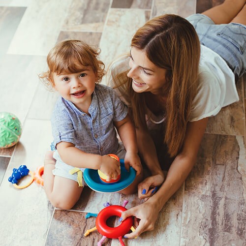 Mom with child playing | Valley Carpet